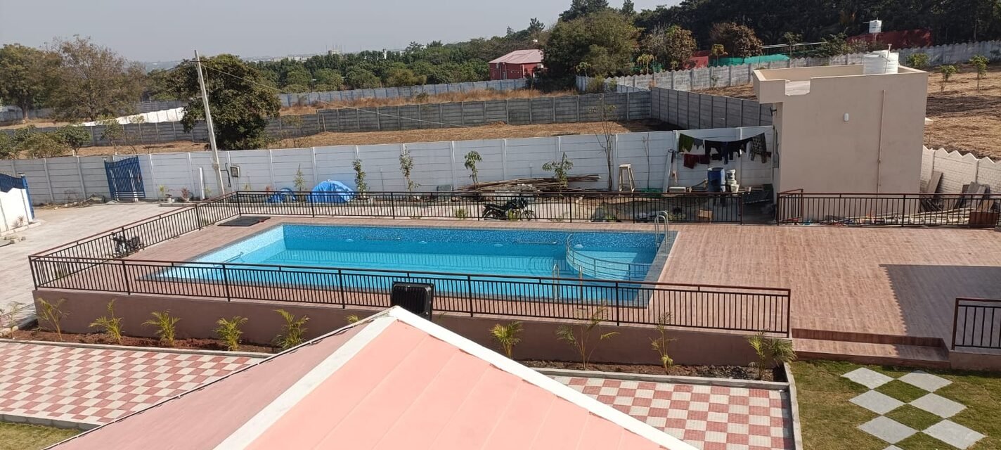 The pool and deck seen from the upper terrace